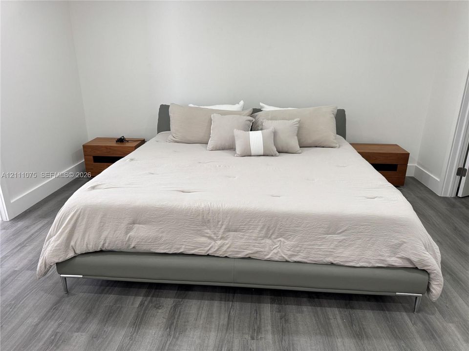 Wood-finish flooring throughout with neutral wall tones