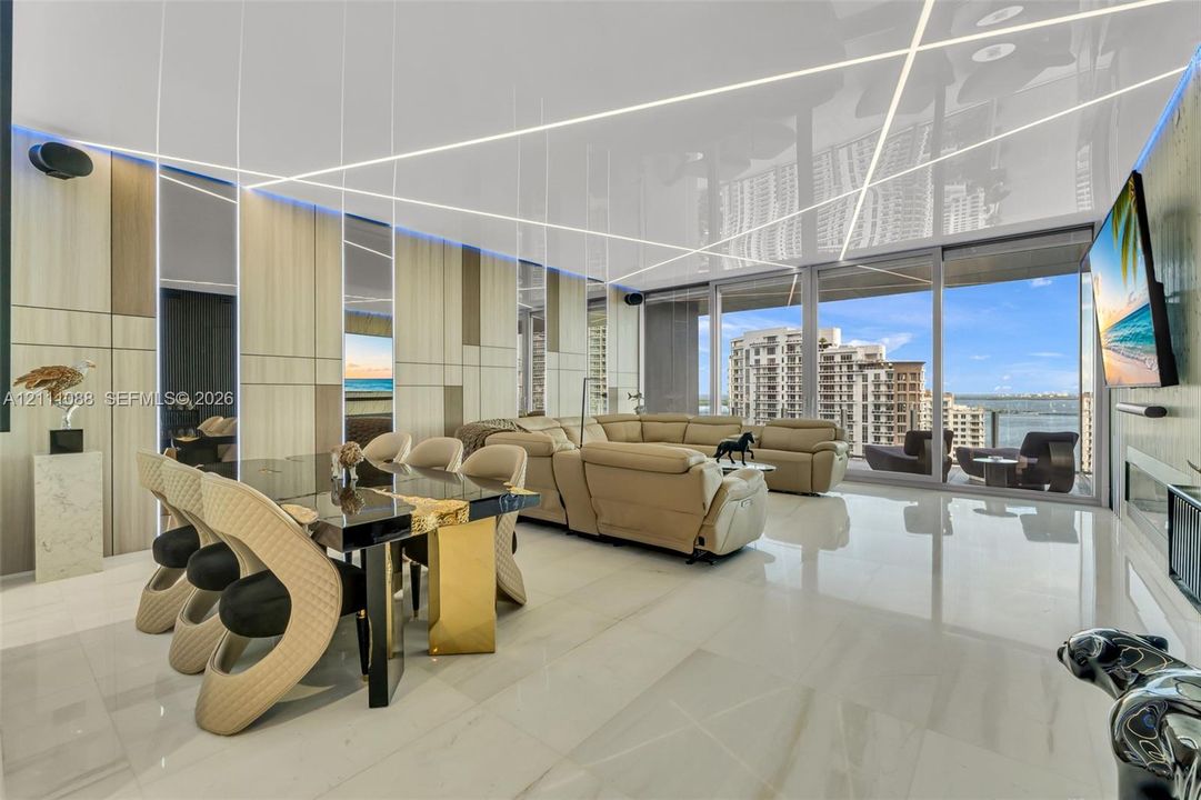 Floor-to-ceiling glass sliding doors, glossy tile flooring, linear LED recessed ceiling lighting, and vertical wood-panel accent walls