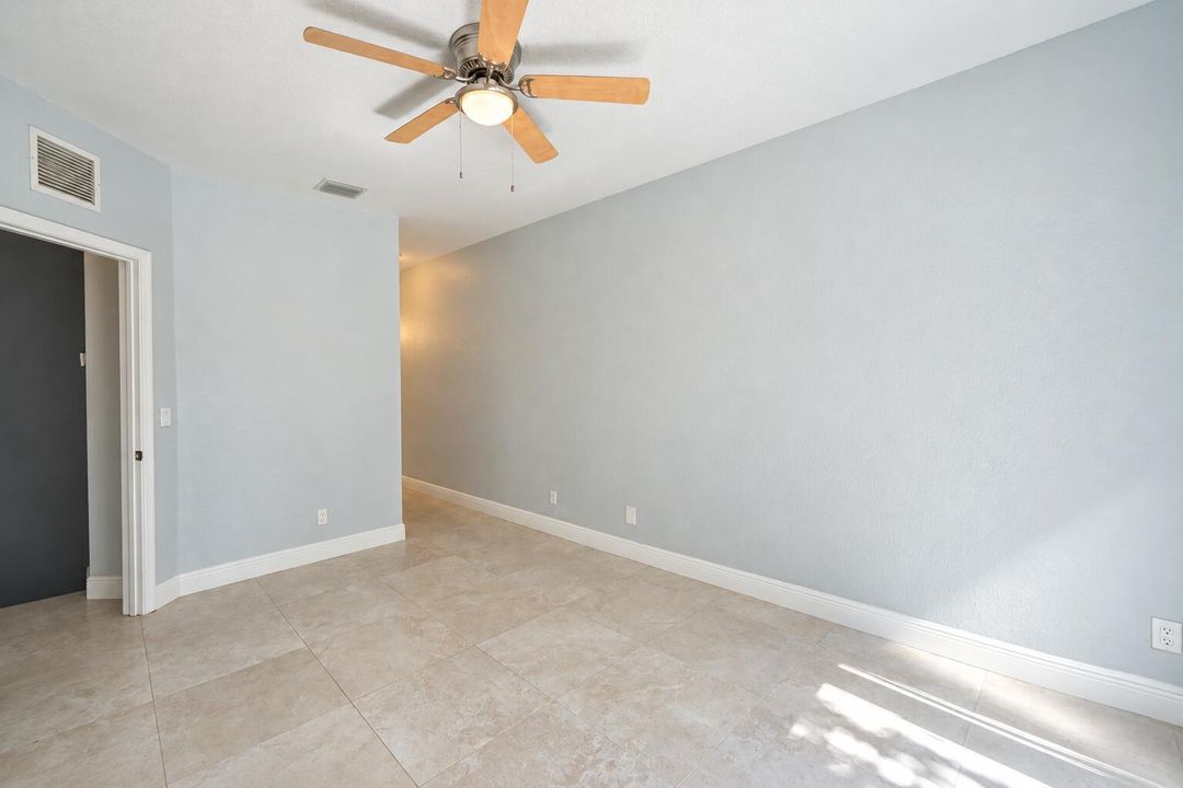 Bright Empty Room with Ceiling Fan