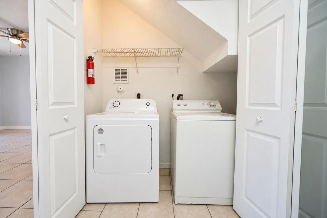 Bright Laundry Closet with Vintage Appli