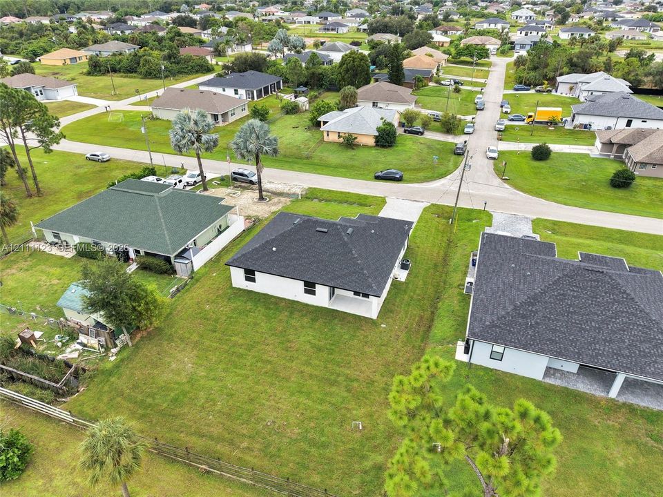 Aerial view of the home and surrounding neighborhood.