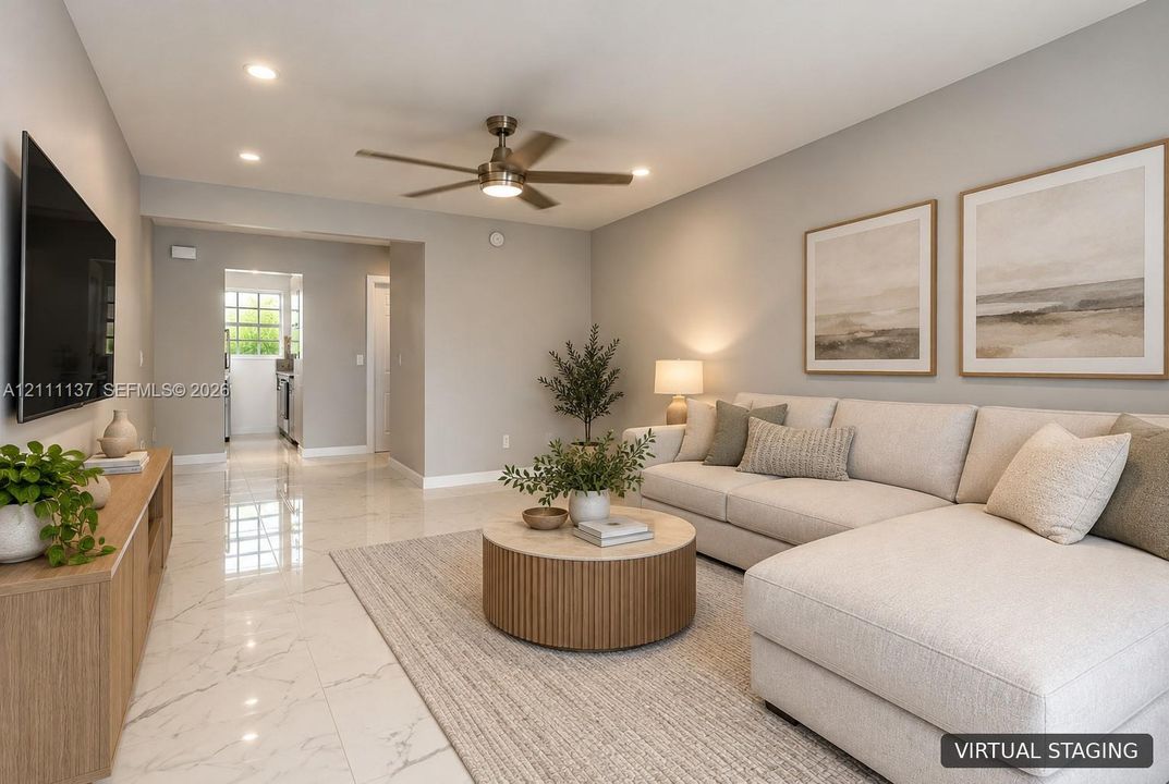 Living area featuring neutral wall paint, polished tile flooring, and a multi-blade ceiling fan with integrated lighting