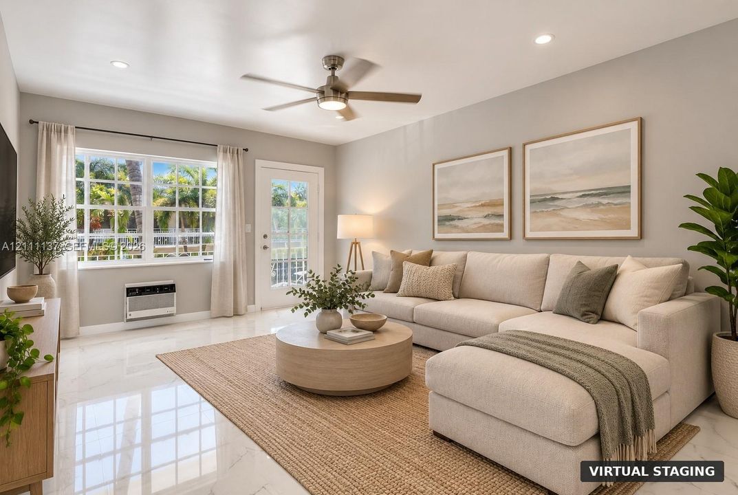 Living area featuring polished stone-finish flooring, recessed lighting, a ceiling fan with integrated light fixture, large multi-pane windows, and a glass-paneled exterior door