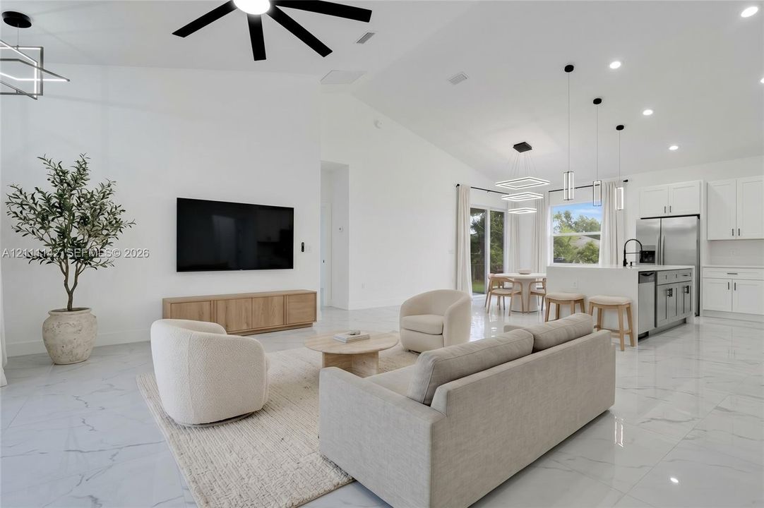 Virtually Staged: living area and kitchen shown with furniture.