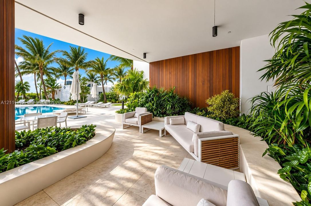 Covered patio featuring large-format stone tile flooring, vertical wood-panel accent wall, integrated recessed lighting, and built-in curved stone planters