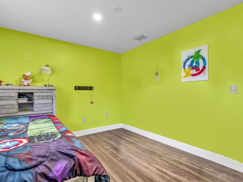 Interior space featuring wood-finish flooring and recessed lighting