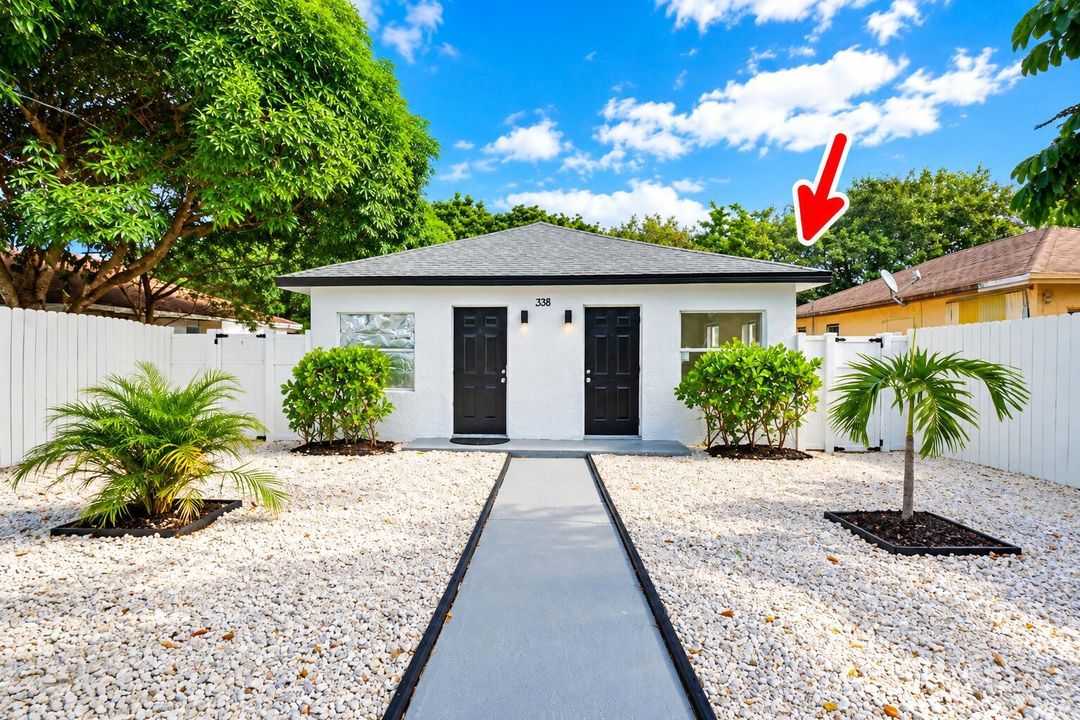 Bright Duplex Exterior with Red Roof Mar