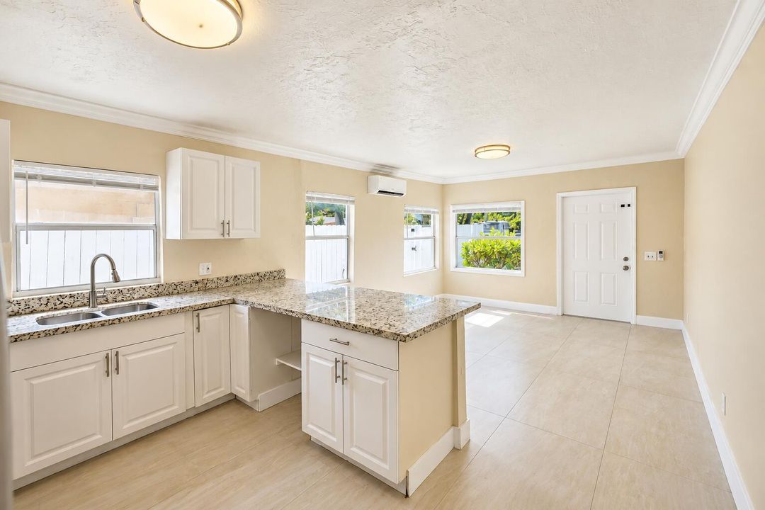 Bright Beige Open-Plan Kitchen and Livin