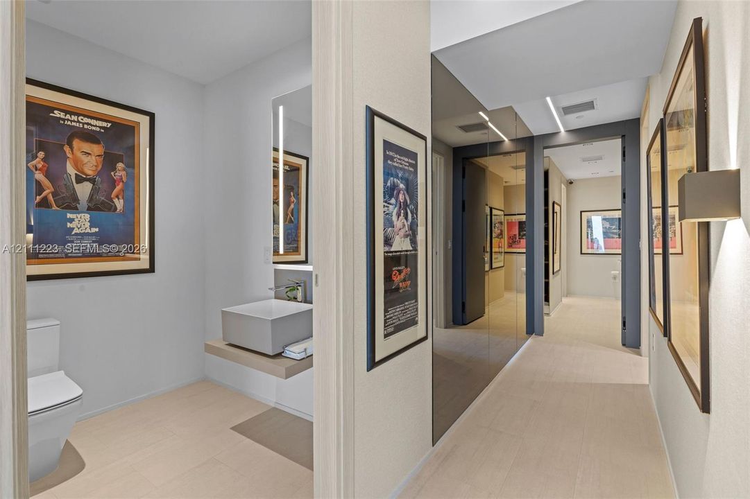 Hallway leading to guest bath, primary room & 2nd bedroom
