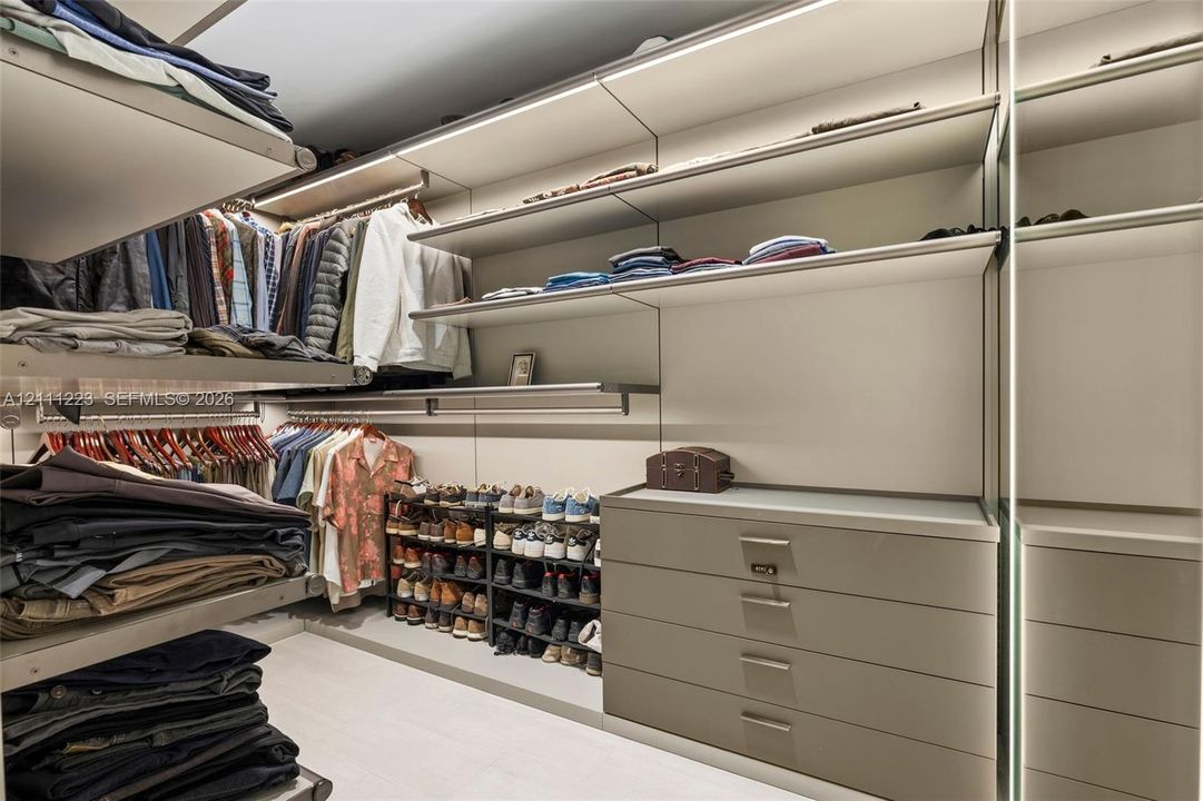 Den converted into custom walk-in closet for primary
