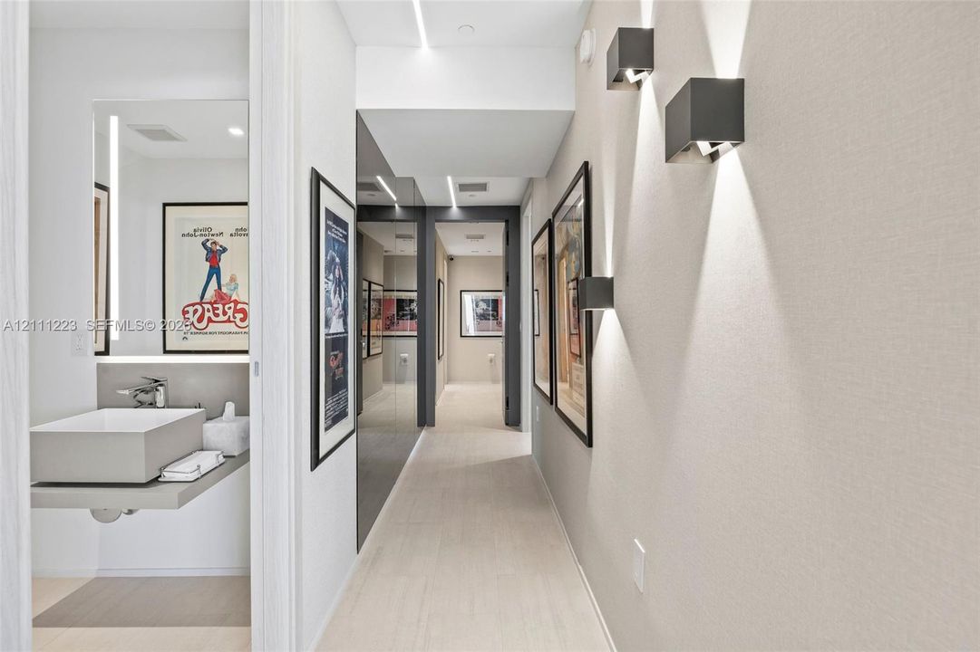 Hallway leading to guest bath, primary room & 2nd bedroom