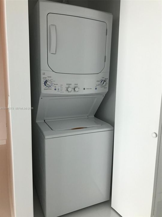 Stacked laundry unit.
