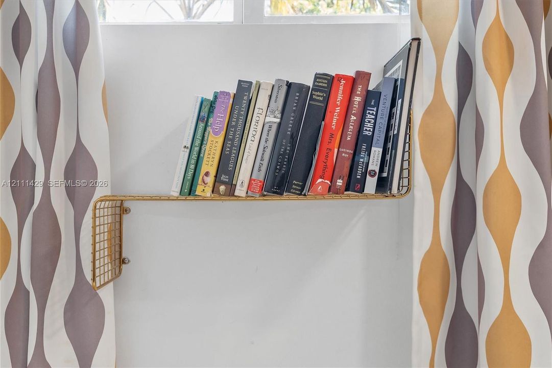 Wall-mounted gold-tone metal grid shelf