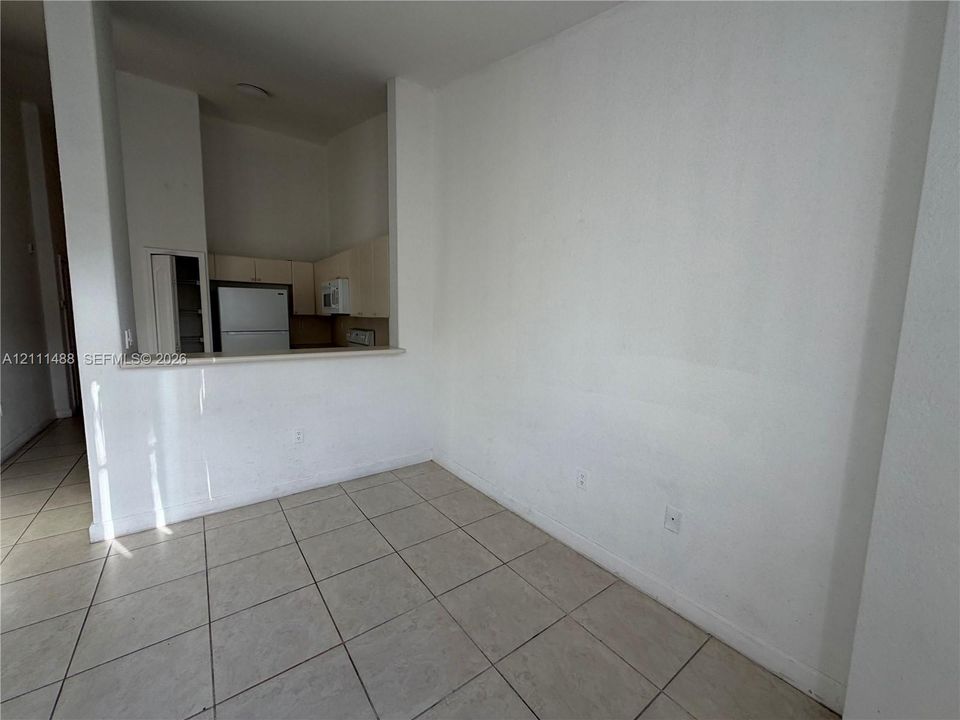 Ceramic tile flooring, pass-through opening, and flat-panel cabinetry