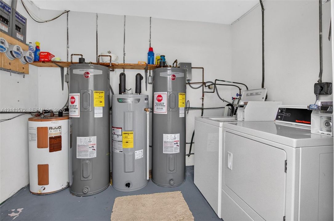 Laundry room shared by 4 units if you don't install your own W/D. Bonus that your water heater won't flood your unit!