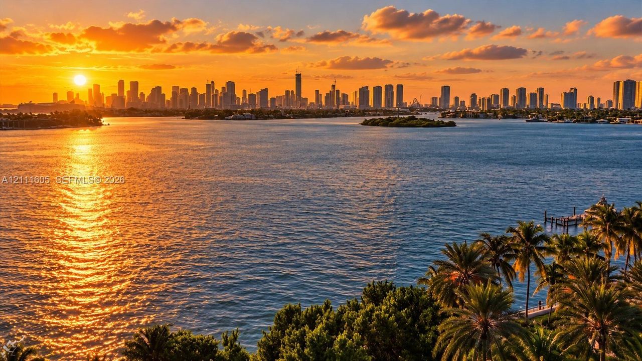 Waterfront setting with a private boat dock, surrounded by mature palm trees and featuring a skyline backdrop
