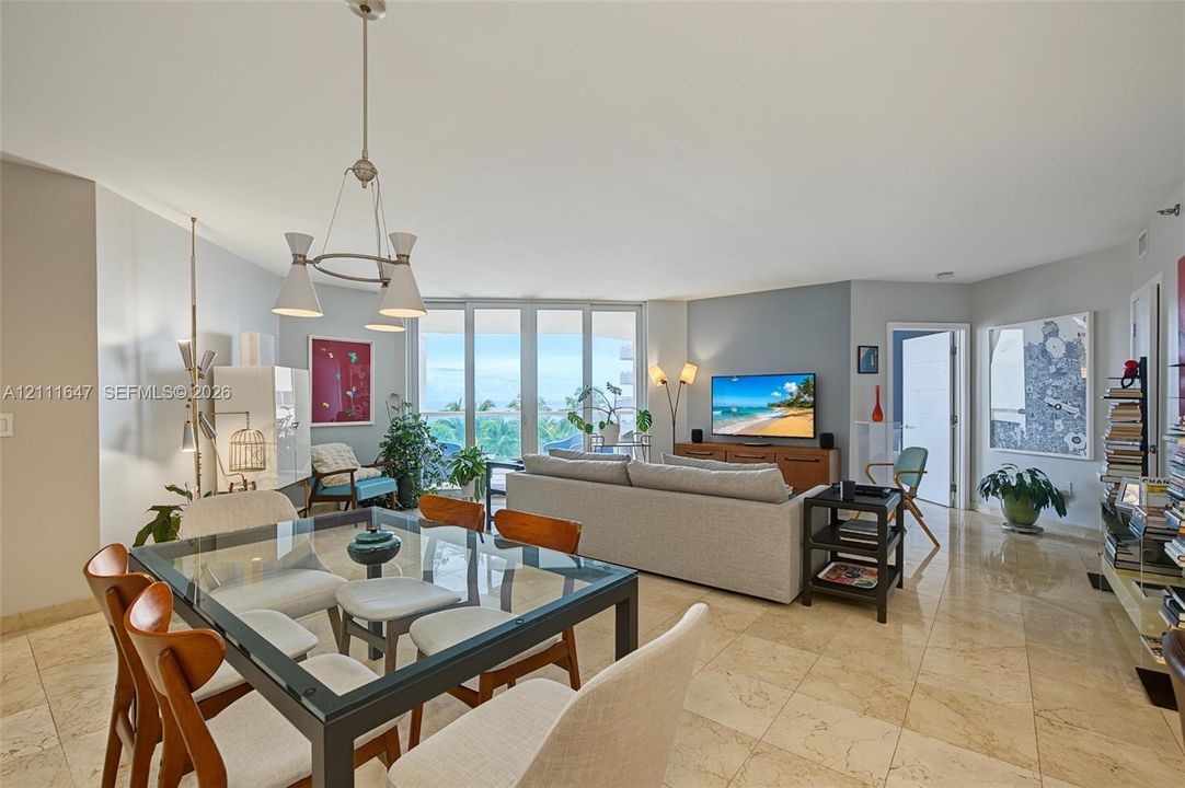 Open-concept living area featuring floor-to-ceiling windows