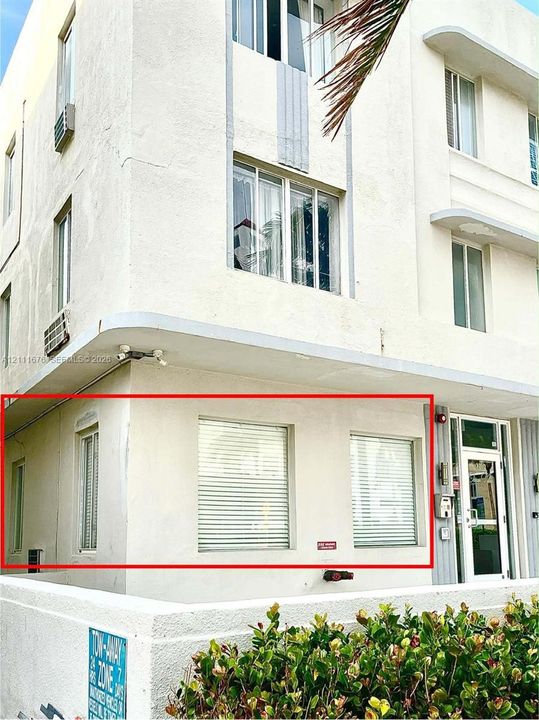 Stucco exterior featuring streamlined architectural detailing, a cantilevered canopy, and multi-pane window configurations