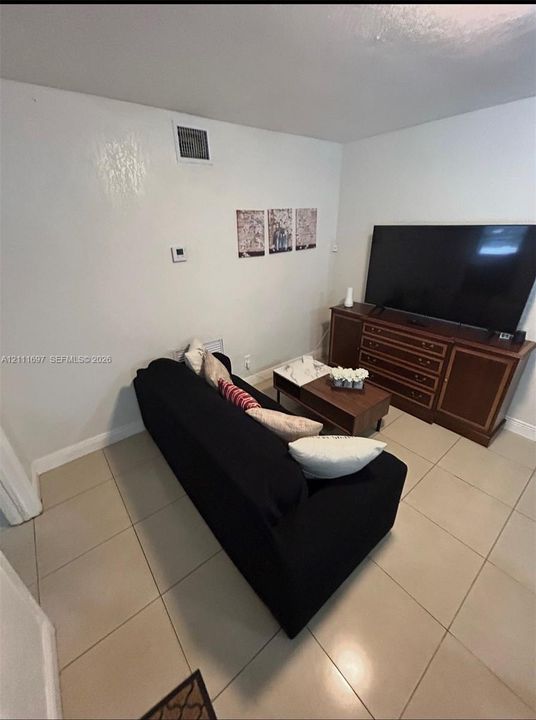 Large-format tile flooring throughout