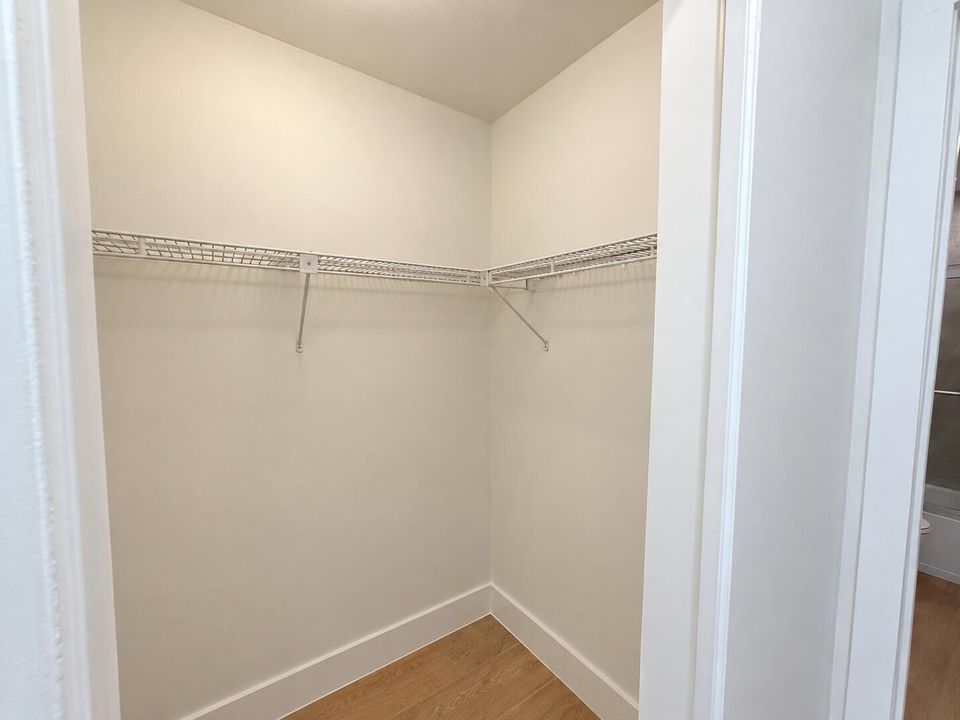 Empty Walk-In Closet with L-Shaped Shelv