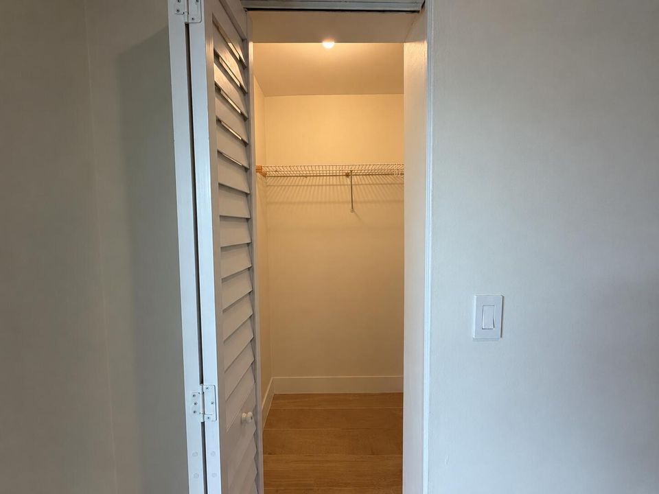 Warmly Lit Empty Closet Alcove