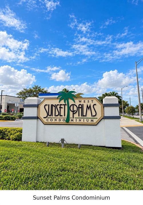 Monument sign for Sunset Palms Condominium featuring stucco masonry construction, decorative pillar accents, and integrated ground-level landscape lighting