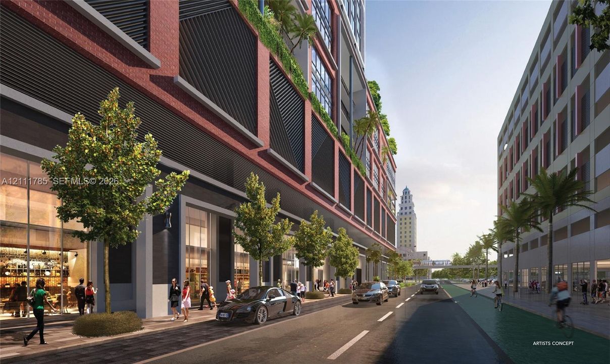 Mixed-use architecture featuring red brick masonry, floor-to-ceiling glass storefronts, structural louvered accents, and integrated vertical landscaping