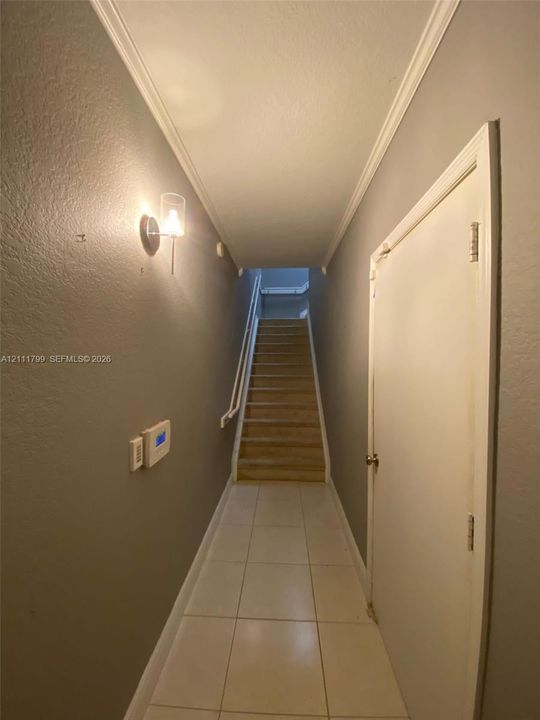 Entry hallway with garage access on the right.