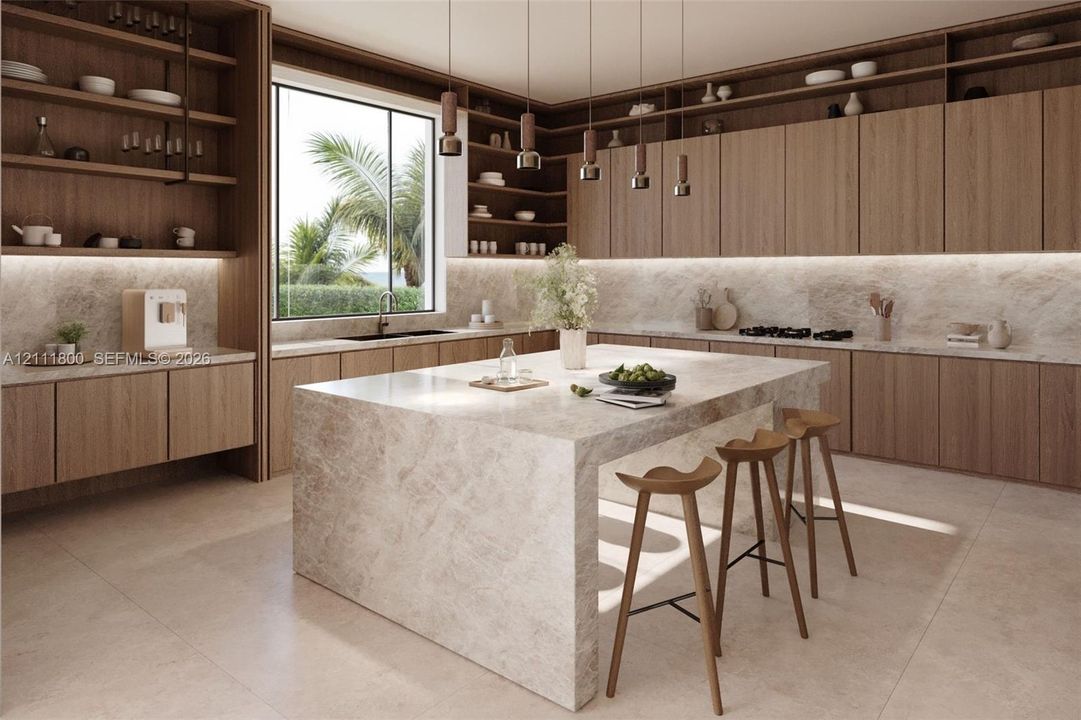 Kitchen featuring wood cabinetry, natural stone countertops with a waterfall edge island, under-cabinet lighting, and built-in shelving