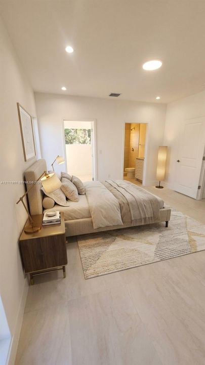 Neutral-toned interior featuring recessed lighting, large-format tile flooring, and solid-core interior doors