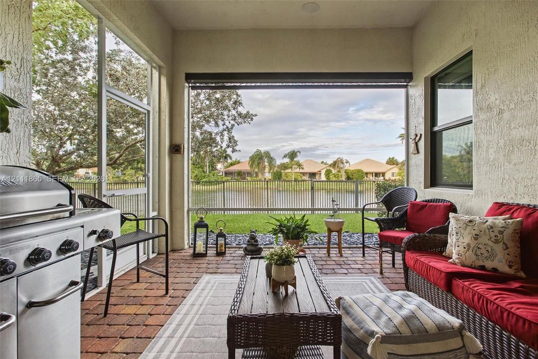 Cozy screened-in lanai with additional sunscreen & great water view.