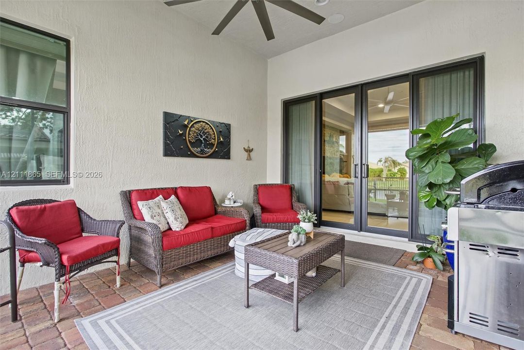 Screened lanai with lighted ceiling fan.