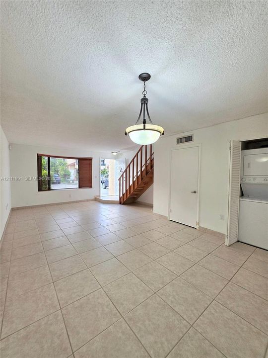 Half bathroom, Tile flooring, stackable washer and dryer