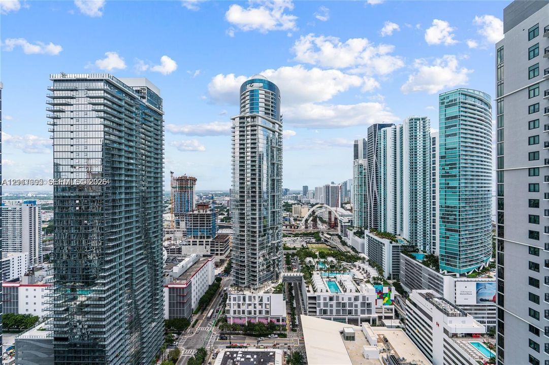 Panoramic urban skyline featuring high-rise architecture, glass-facade towers, and expansive metropolitan surroundings