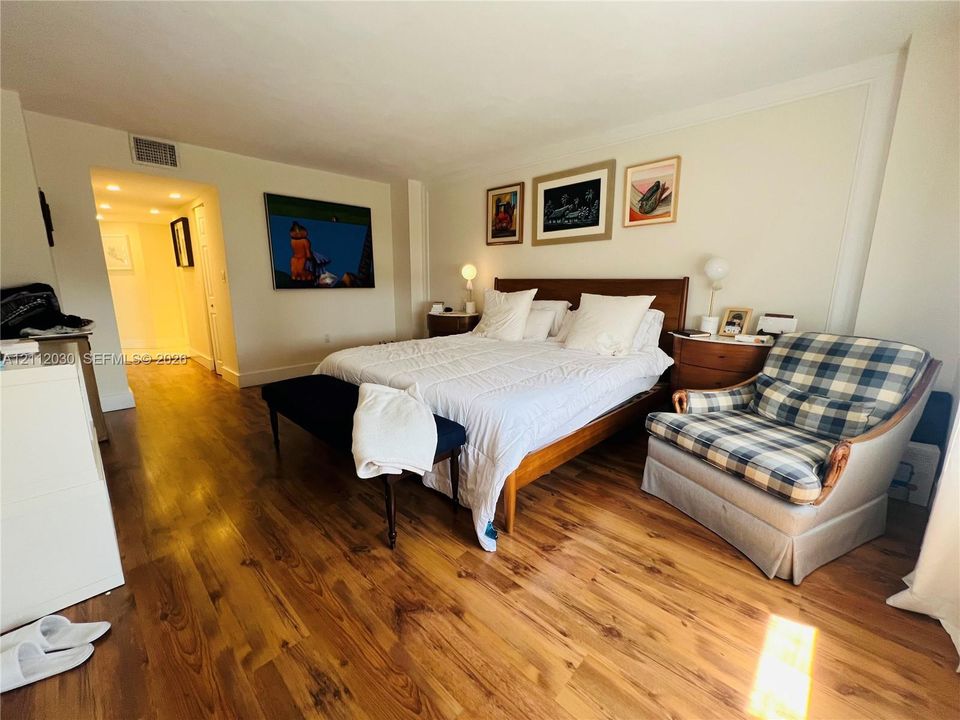 Room featuring wood-finish flooring, neutral wall tones, and recessed ceiling lighting