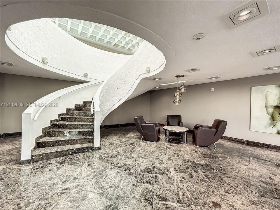 Extended lobby to stairs to the pool and clubhouse