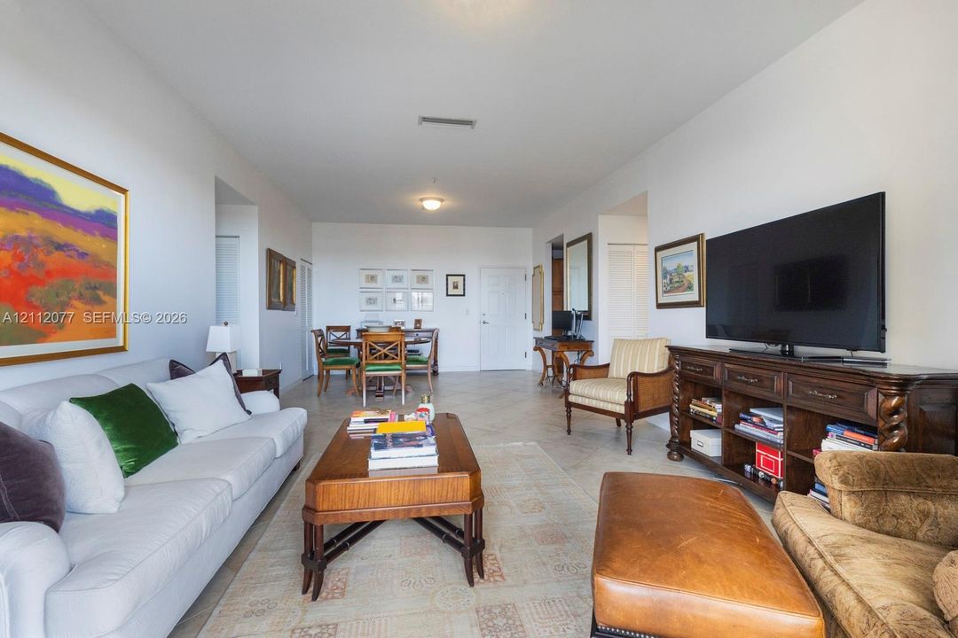 Open-concept interior space featuring tile flooring, smooth high ceilings, and inset lighting