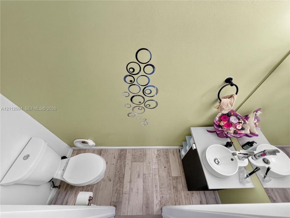 Bathroom featuring wood-finish flooring, vanity