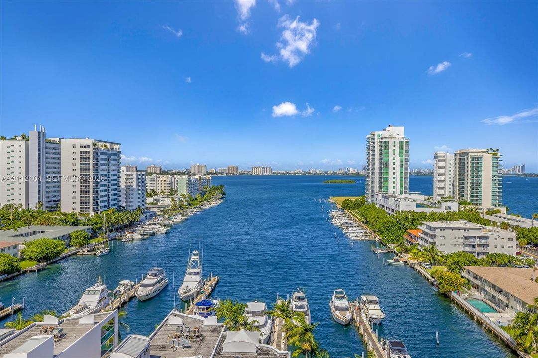 Panoramic water expanse featuring a direct waterway channel, deep-water dockage, and coastal high-rise architecture