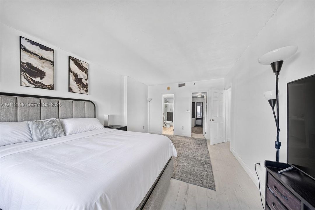 Bright interior featuring wood-finish flooring and smooth-finish walls