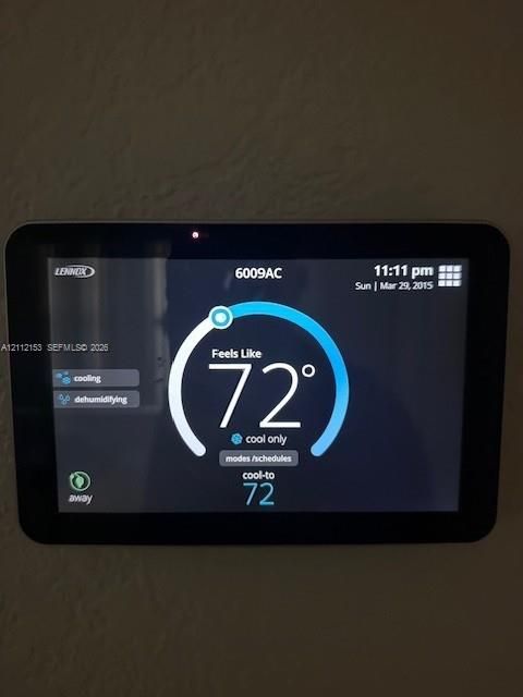 Wall-mounted Lennox programmable digital climate control interface