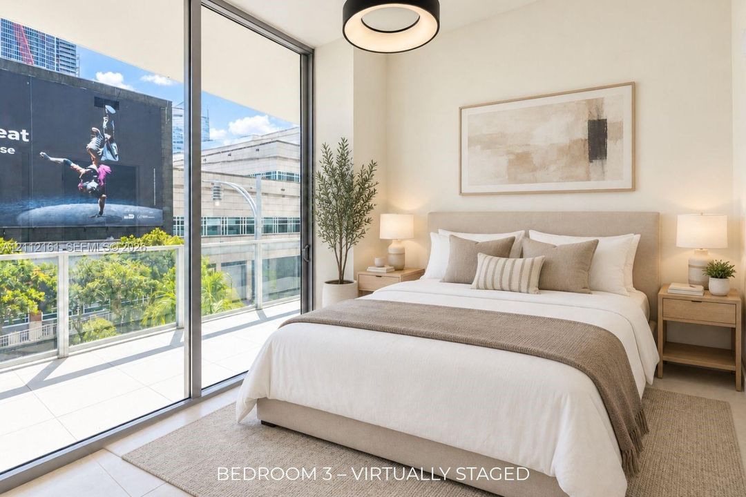 Floor-to-ceiling sliding glass doors, tile flooring, glass-paneled balcony railing, and modern circular pendant lighting