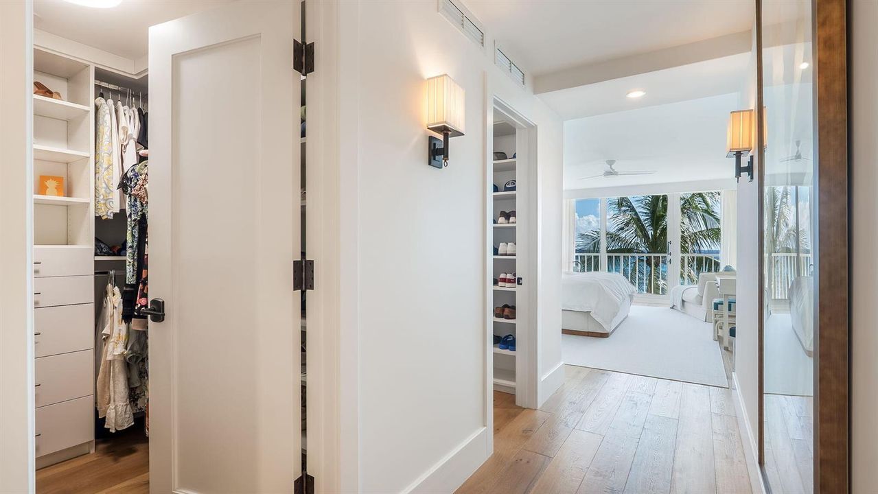 Hallway with 2 walk-in closets
