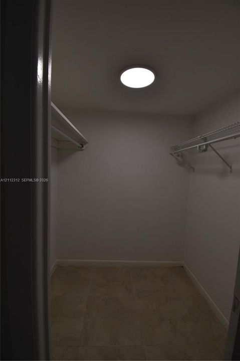 Walk-in closet in primary bedroom