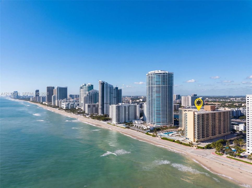 High-rise residential building situated on the Atlantic coastline featuring direct beach access and proximity to urban infrastructure