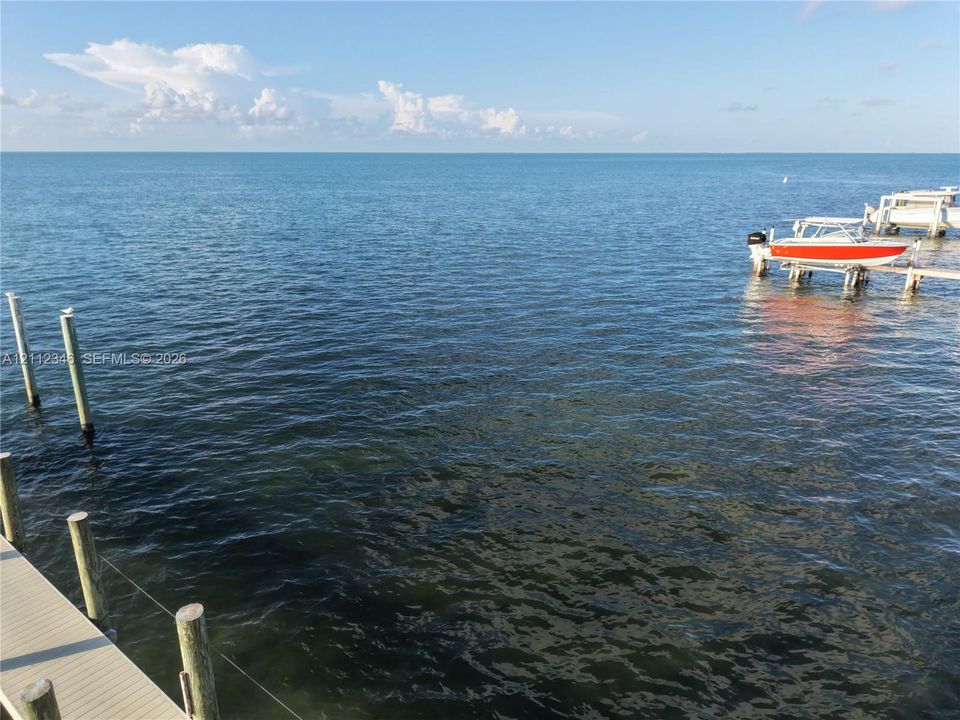 Waterfront property featuring a private wooden dock and deep-water access