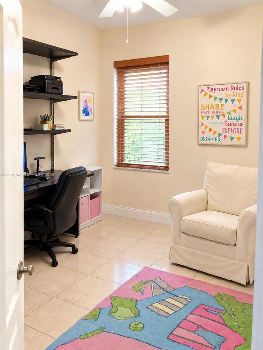 Room featuring neutral tile flooring, a window with wooden slat blinds, and an integrated ceiling fan with light fixture