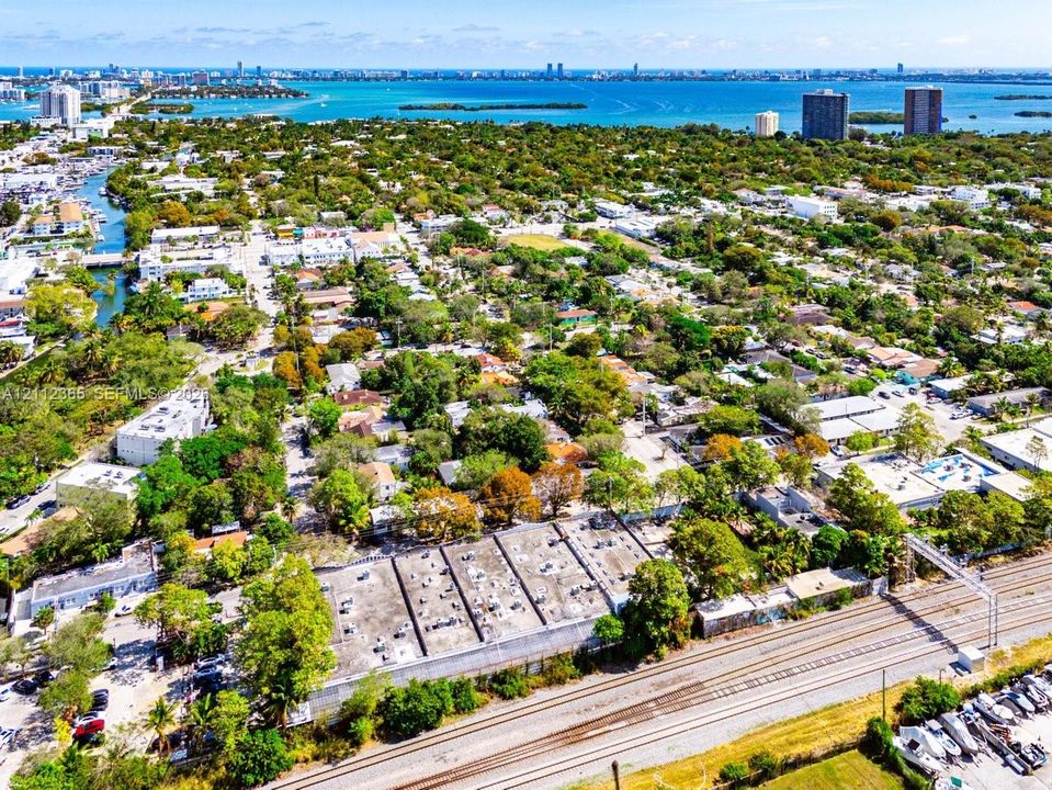 Aerial perspective of the property featuring proximity to coastal waterways and dense mature tree canopy