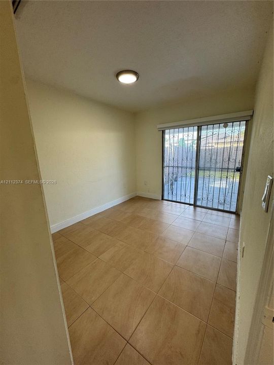 Bedroom Two with patio view