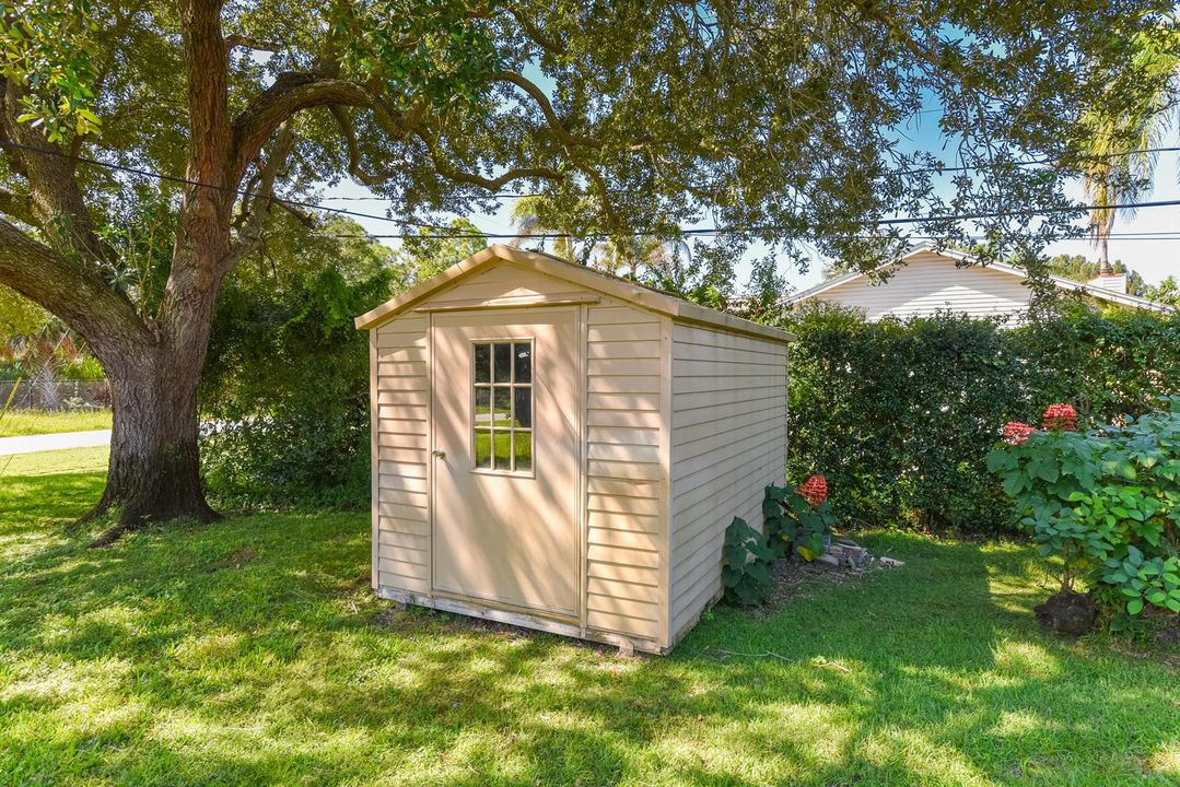 Two Storage Sheds, One with Electric